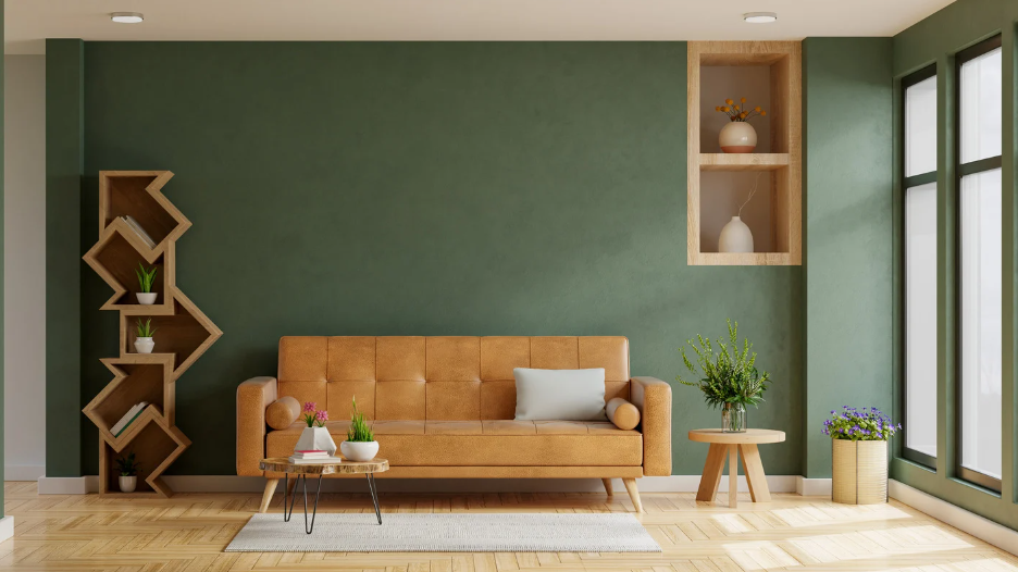 Calm minimalist living room with muted green walls, warm timber furniture and soft lighting, showcasing harmonious residential colour consultation.