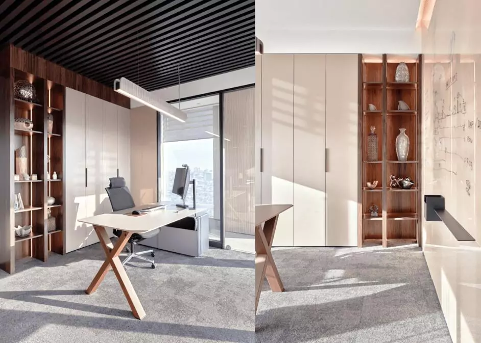 Modern executive office design with sleek furniture and wood shelving in London by Oraanj Interior Design.