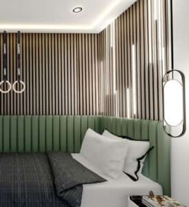 Stylish modern bedroom in Bromley by Oraanj Interior Design, featuring a green upholstered bed, vertical wood panelling, and ambient lighting.