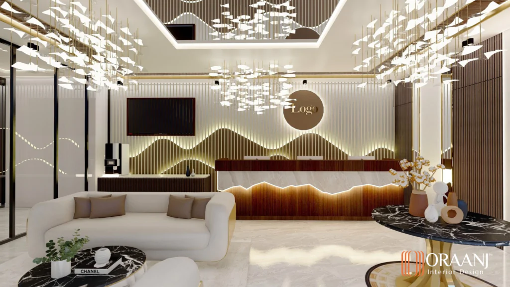 Luxury office reception interior design in London featuring marble finishes, warm lighting, sculptural chandeliers, and stylish lounge seating, designed by Oraanj Interior Design.