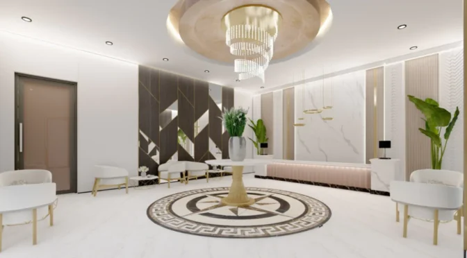 Luxury office space in London designed by Oraanj Interior Design, showcasing a modern reception area with a marble floor, elegant chandelier, white furniture, and indoor plants.