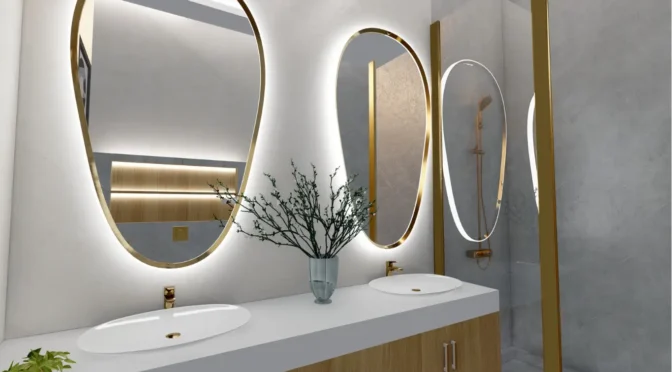 Elegant bathroom decor in London designed by Oraanj Interior Design, featuring illuminated oval mirrors, a modern double sink vanity, and gold accents.