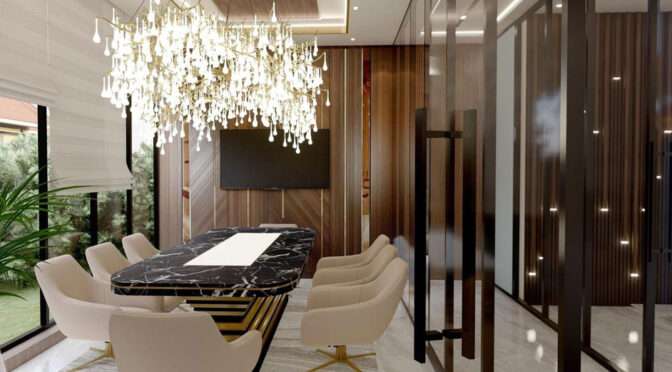 Luxurious conference room by Oraanj Interior Design featuring a black marble table, plush seating, and a grand crystal chandelier.