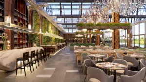 A modern, luxurious restaurant interior in London designed by Oraanj Interior Design, featuring elegant chandeliers, greenery, and a stylish bar area.