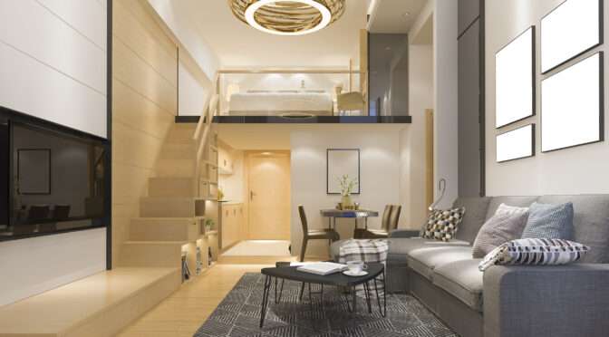 Interior design for small spaces shown in a modern loft apartment with wood staircase, mezzanine bed, gray sofa, and compact layout.