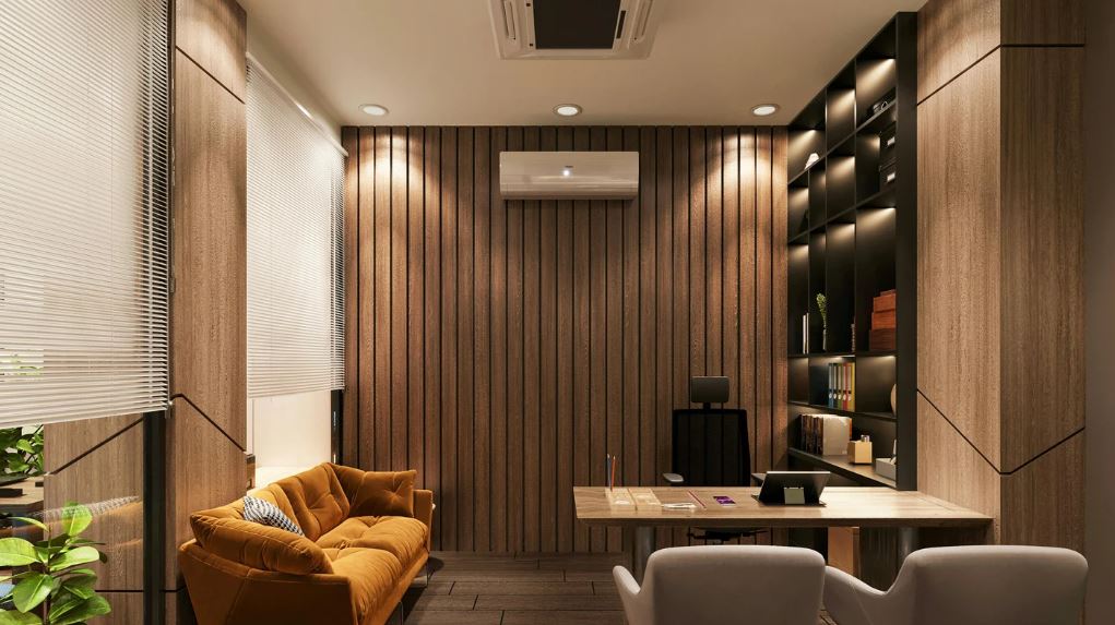 Modern meeting room with vertical wood panelling, built-in shelving, warm lighting, and contemporary seating.