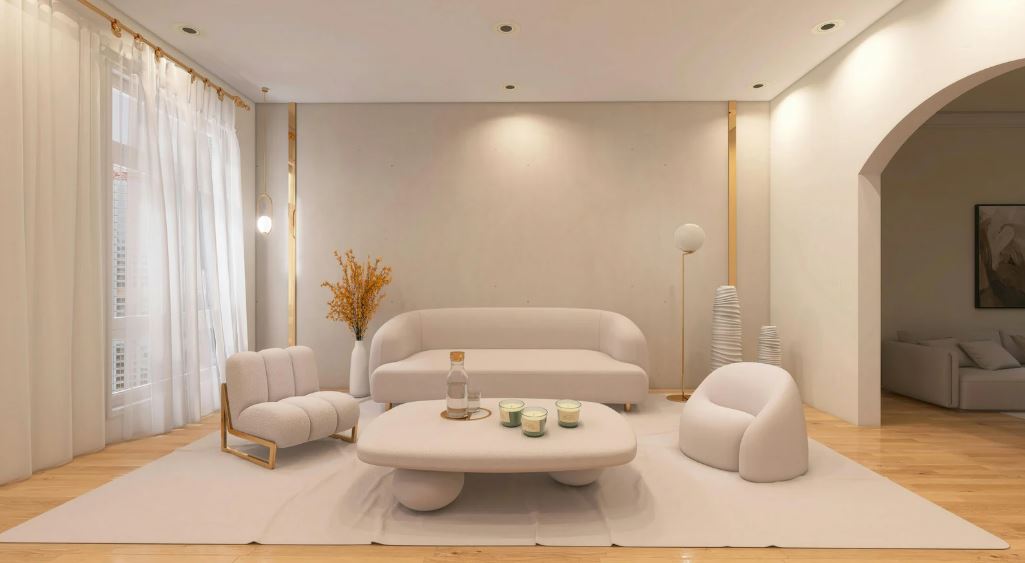 Soft minimalist living room with curved sofa, sculptural chairs, neutral tones, gentle lighting, and a calm, contemporary atmosphere.