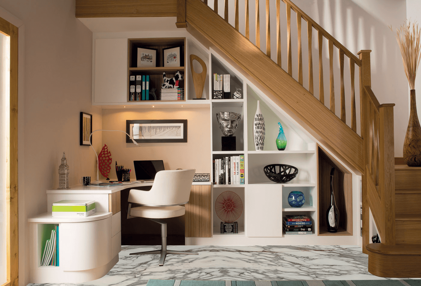 Under-stair home office with built-in shelving, compact desk, wooden staircase, and smart storage in a small contemporary space.