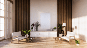 A minimalist living space with two modern lounge chairs, a low console, vertical wood slat wall panels, indoor plants, and soft natural light from large windows.