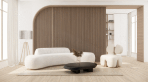 A minimalist living room with a sculptural white sofa, curved wood-paneled feature wall, low round coffee table, accent chair, light wood flooring, and soft natural light.