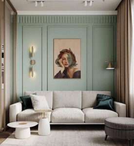 Neoclassical living room with green paneled walls and modern beige sofa