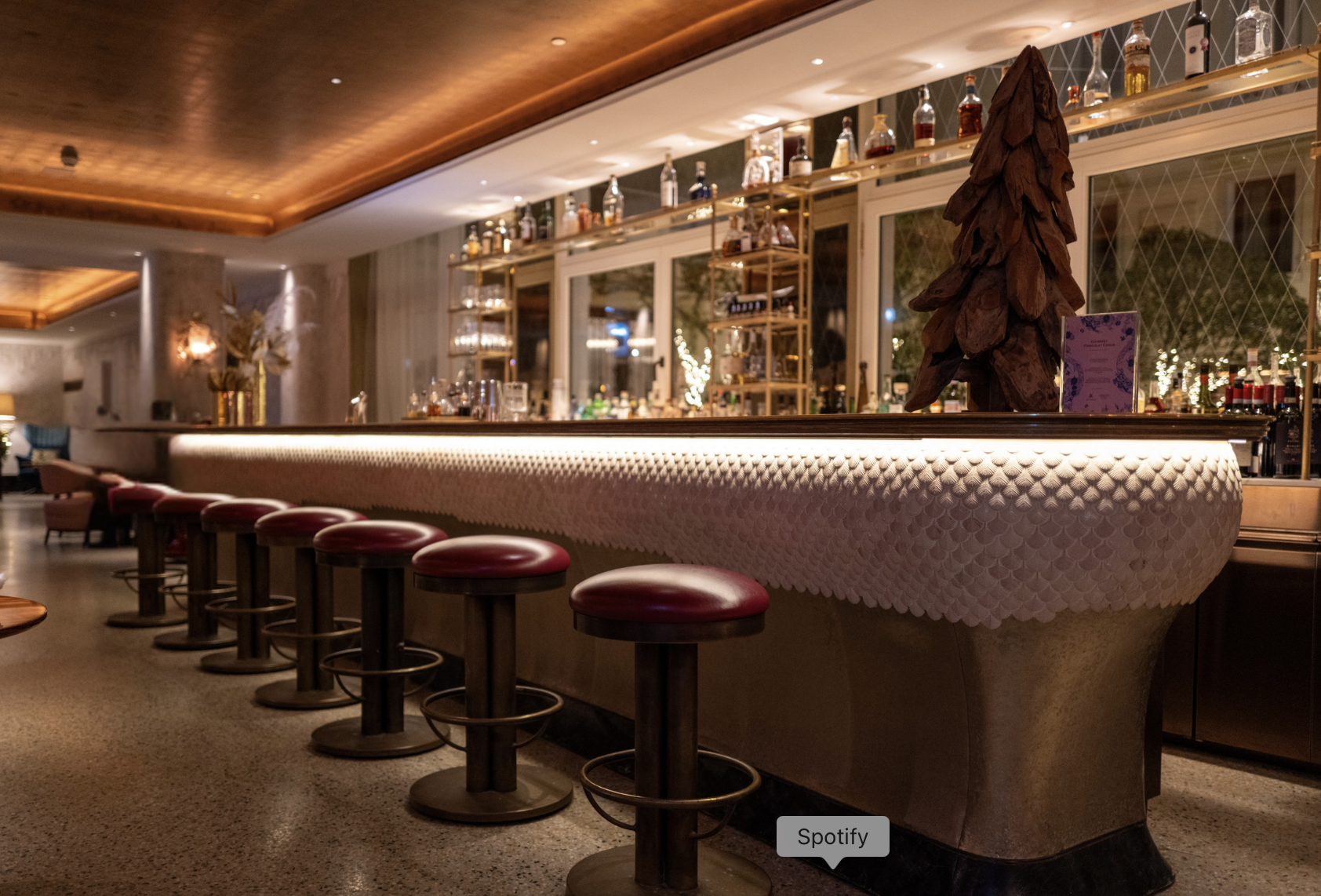 Elegant Cocktail Bar Seating Design Refined cocktail bar seating with leather stools, illuminated counter and premium finishes for luxury hospitality venues.