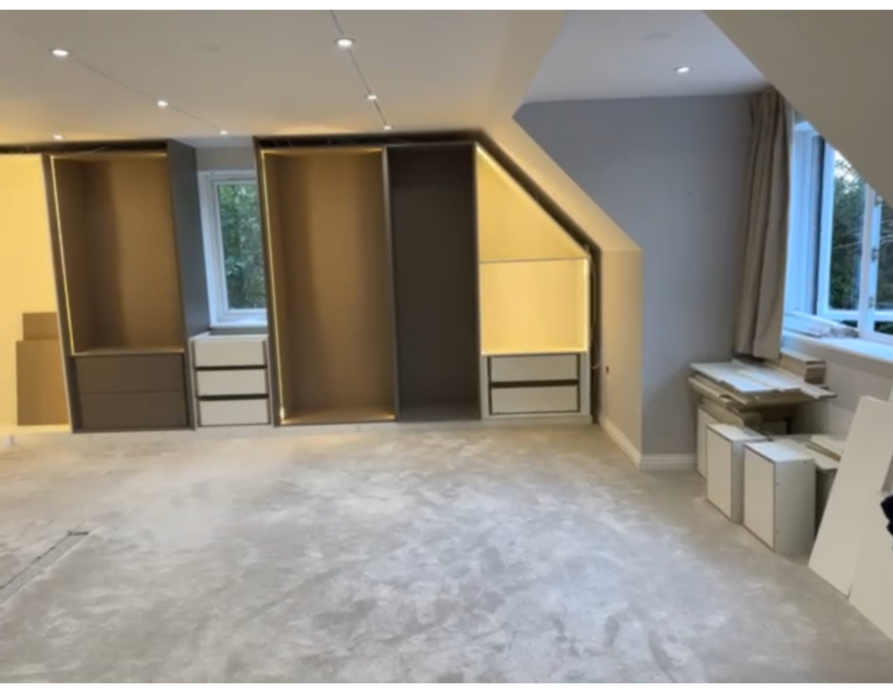 Custom Wardrobe Installation as Part of Full Interior Service Built-in wardrobes with integrated lighting installed by Oraanj Interiors, delivering tailored storage solutions as part of their complete interior design service.