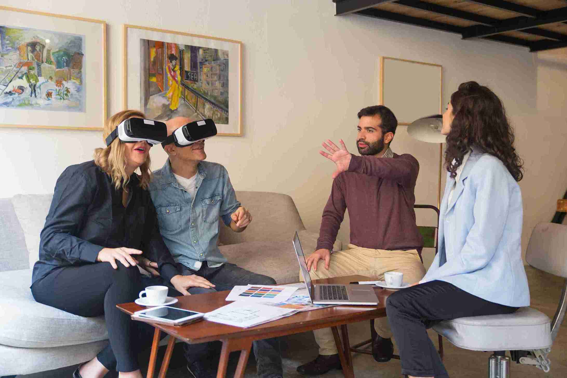Virtual Reality Interior Design Consultation in London Interior design consultation using virtual reality headset with clients reviewing layout plans and color samples alongside a designer.